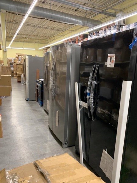 Aisle of major appliances in the warehouse
