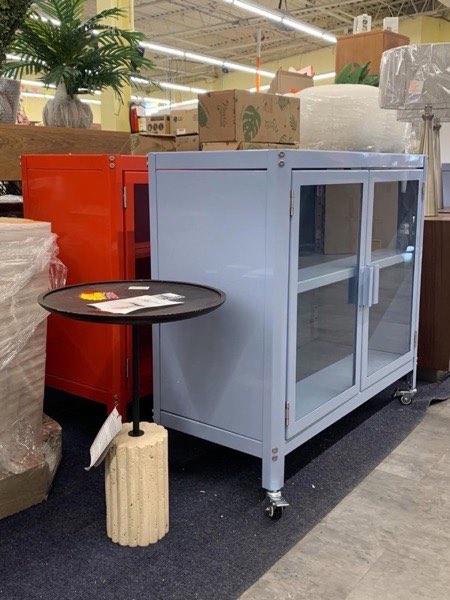 Grey storage cabinet with glass doors